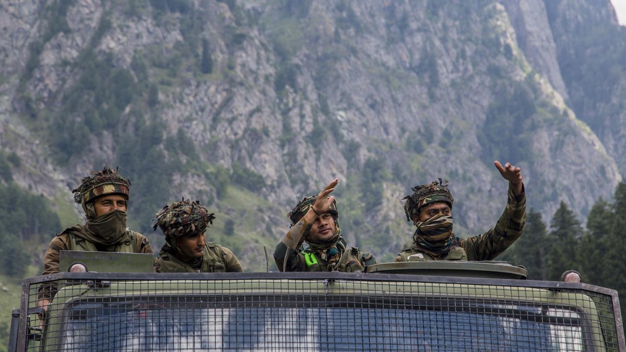 An Indian army convoy carrying reinforcement and supplies, drives towards Leh, on a highway bordering China. Picture: Yawar Nazir/Getty Images