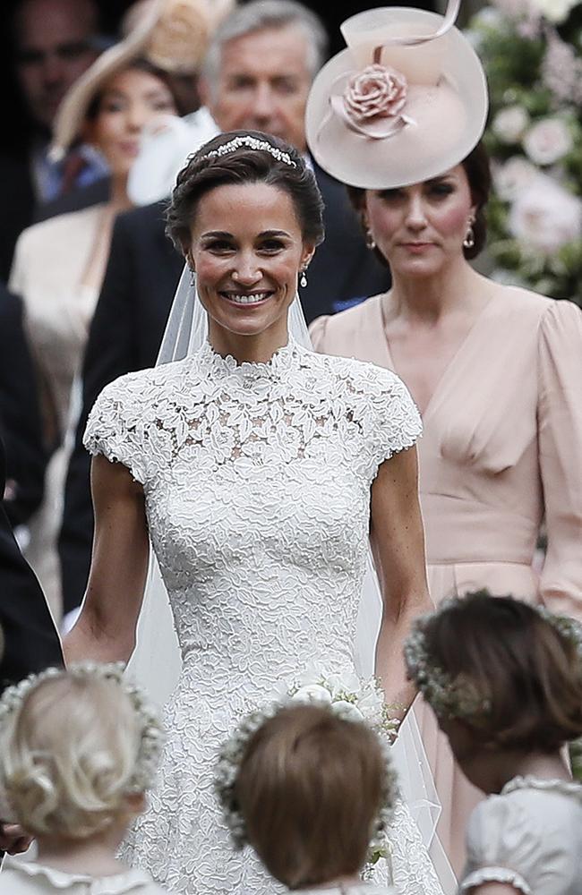 Kate follows her sister and new brother-in-law outside the church.