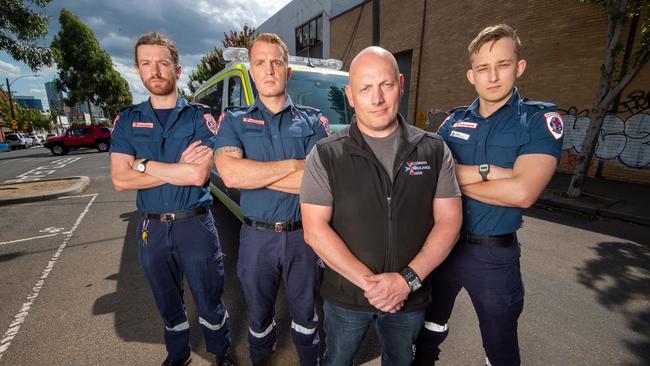 Victorian Ambulance Union secretary Danny Hill, centre, with paramedics. Picture Jay Town