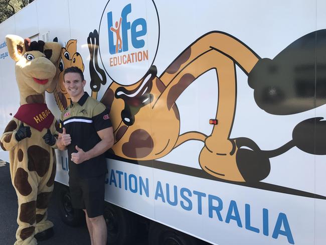 Penrith Panthers player Tim Browne with Healthy Harold.