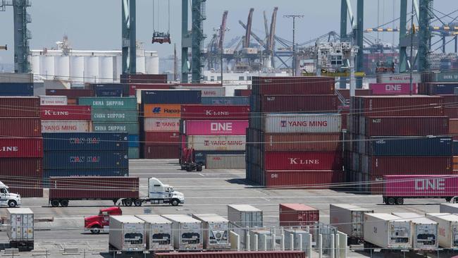 Shipping containers from China and Asia are unloaded at the Long Beach port, California on August 1, 2019. - President Donald Trump announced August 1 that he will hit China with punitive tariffs on another $300 billion in goods, escalating the trade war after accusing Beijing of reneging on more promises. (Photo by Mark RALSTON / AFP)