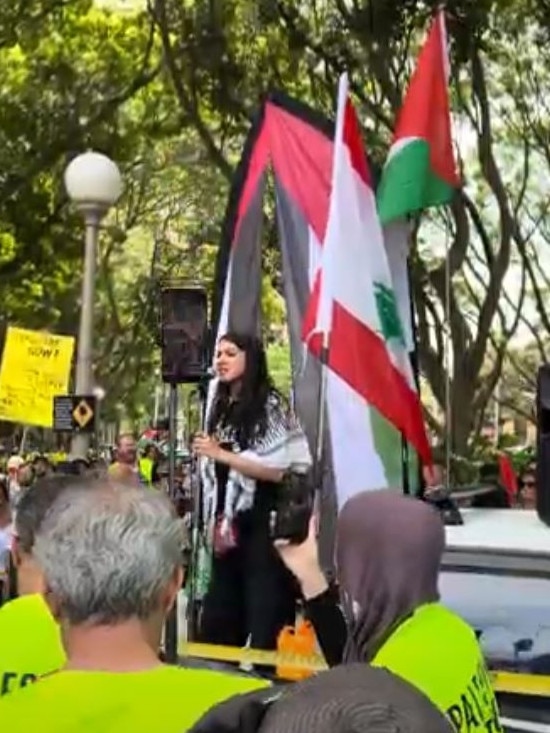 A protest organiser leading chants