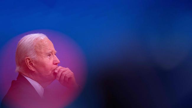 Joe Biden listens during a briefing about Hurricane Milton in the Eisenhower Executive Office Building.