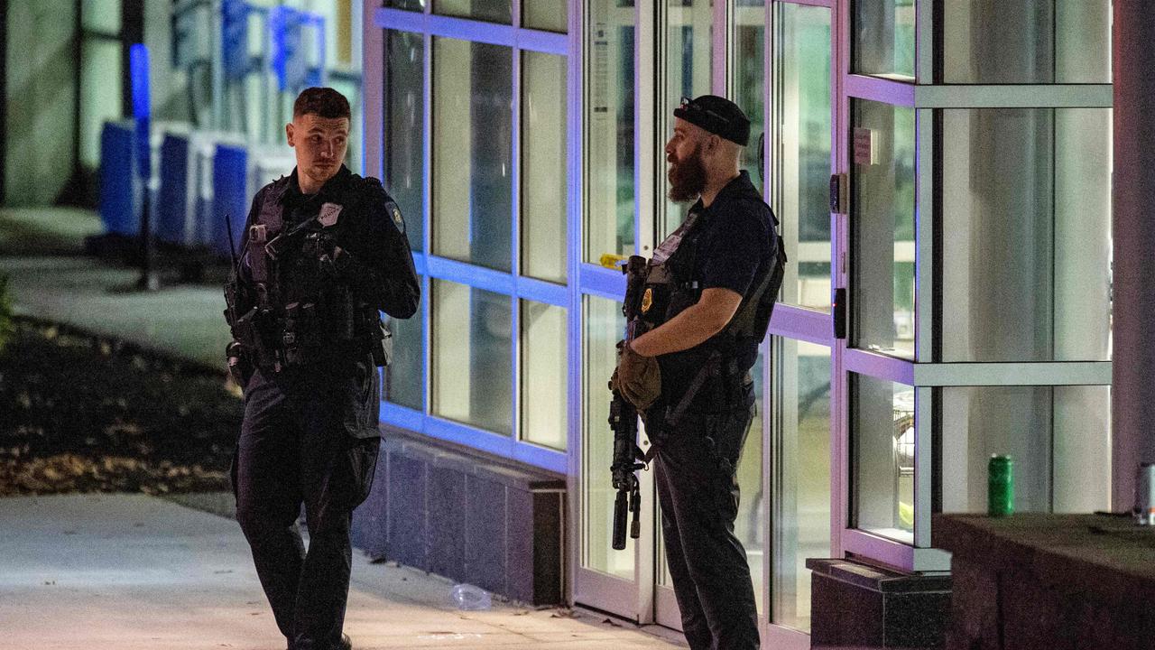 Armed law enforcement officials guard Central Maine Medical Center, which said it was reacting to a “mass casualty” event. Picture: Joseph Prezioso/AFP