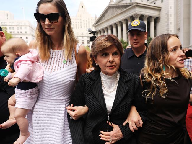 Attorney Gloria Allred (centre) leaves a New York courthouse with two women, a woman who did not wish to be identified (left) and Teala Davies (right), who have publicly accused Jeffrey Epstein of sexually assaulting them. Picture” Getty Images/AFP