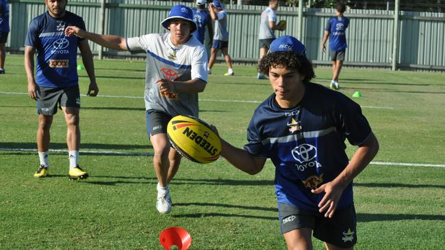 Perese (middle) at a Cowboys training session for up and coming stars with Matt Bowen (back) in 2012.