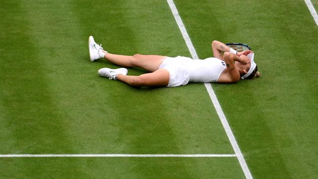 Marketa Vondrousova falls to the floor as she celebrates winning match point. Picture: Getty