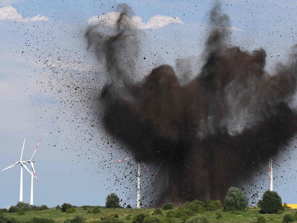 An aircraft bomb from WWII is blasted on a field near Bremen, northern Germany, on July 24, 2016. The bomb was found in the centre of Bremen and transported to the field as a diffusing was not possible. Picture: AFP PHOTO / dpa / Ingo Wagner