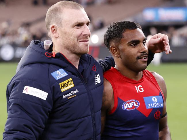 MELBOURNE, AUSTRALIA - AUGUST 23: Simon Goodwin, Senior Coach of the Demons embraces Kysaiah Pickett of the Demons after  the round 24 AFL match between Melbourne Demons and Collingwood Magpies at Melbourne Cricket Ground, on August 23, 2024, in Melbourne, Australia. (Photo by Darrian Traynor/Getty Images)