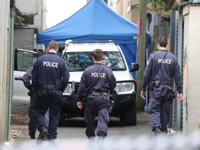 Officers from the Federal Police and the riot squad are still at the Surry Hills house today. Picture: John Grainger