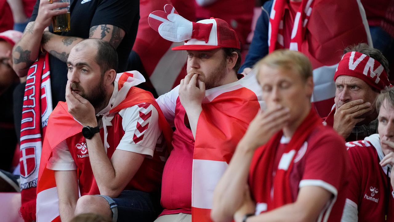 Denmark fans look dejected.