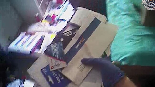 A 36-year-old Southport man has been charged after police raided his Scarborough Street home and found about 500 pieces of mail, including bills, gifts and parcels. Picture: supplied footage