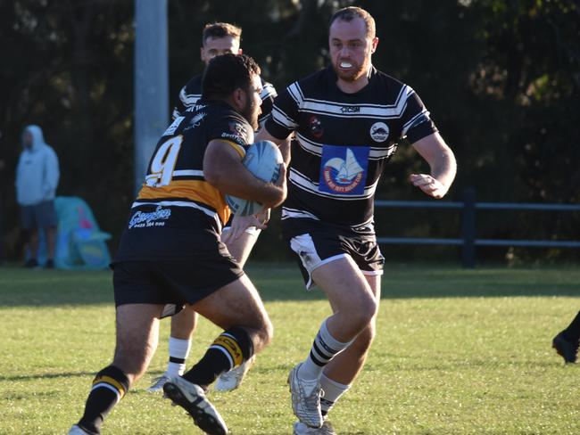 Kyle Leonard runs at Brayden Irons. Picture: Sean Teuma/NewsLocal