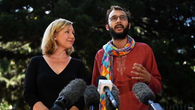 Troubled waters: Greens Senator Larissa Waters (left) listens to Brisbane City Councillor Jonathan Sri speaking to the media after she announced her resignation in Brisbane on Tuesday. Picture: AAP