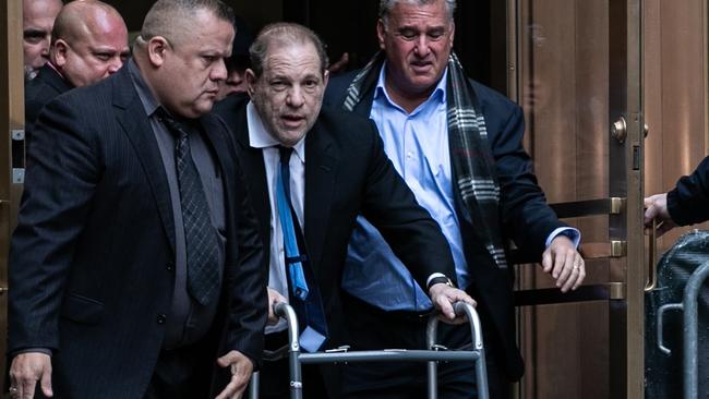 Movie producer Harvey Weinstein departs from criminal court after a bail hearing on December 11 using a walker. Picture: Jeenah Moon/Getty Images/AFP