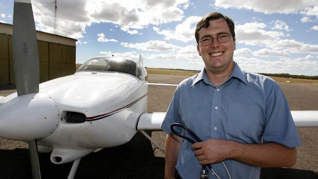 Dr Scott Lewis pictured several years ago with his plane.