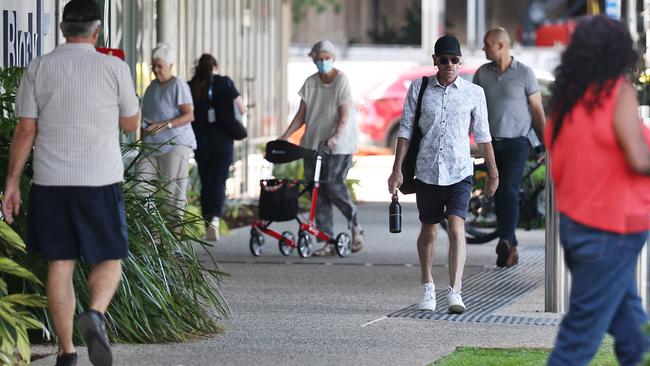 People make their way past E Block at the Cairns Hospital. Picture: Brendan Radke