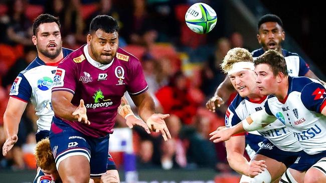 The Queensland Reds’ Taniela Tupou makes a pass during the Rugby AU preliminary final match against the Melbourne Rebels on Saturday. Picture: Patrick Hamilton/AFP