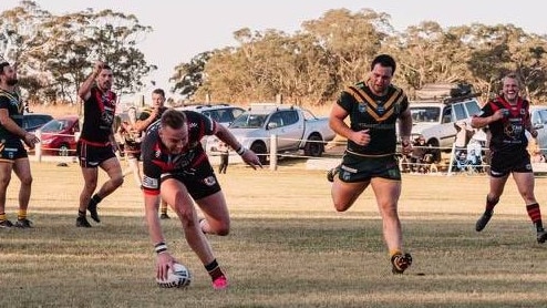 Mitchell Brasington scoring a try.