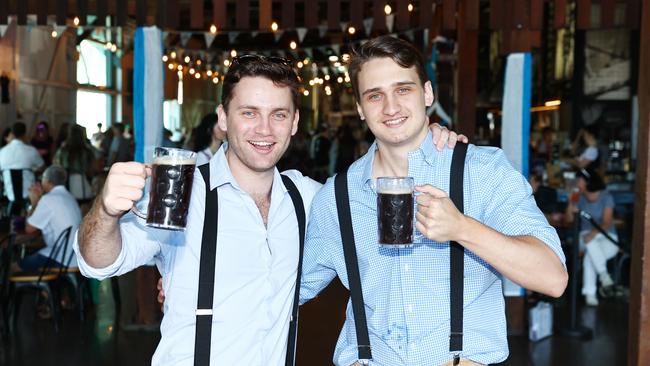 Joshua Keevers and Fletcher Clarke celebrate Oktoberfest at Hemmingway's Brewery. Picture: Brendan Radke