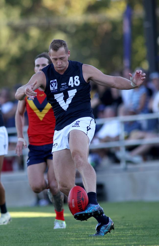 Nathan Kreuger gets a kick away for the VFL representative side. Picture: Kelly Barnes/AFL Photos/via Getty Images