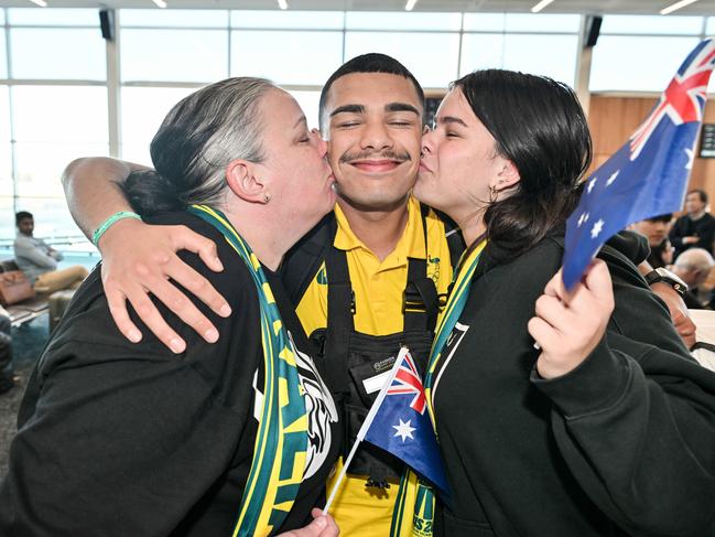 South Australian Olympic boxer Callum Peters with his mum Cassie and sister Lana Peters at Adelaide Airport. Picture: NewsWire / Brenton Edwards