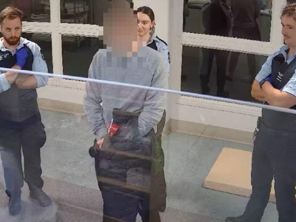 A 17-year-old boy was mocked during intake at an ACT watch house in 2024. Several officers standing behind the teenager – none of whom made the offensive comment – can be seen smirking in the vision.