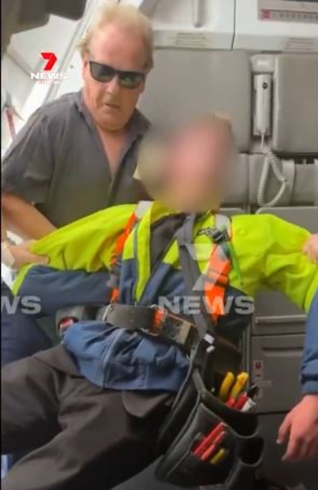 The 17-year-old was restrained by passenger Barry Clarke and crew members. Picture: 7News