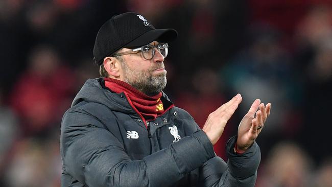 Liverpool's German manager Jurgen Klopp reacts at the final whistle during the UEFA Champions league Round of 16 second leg football match between Liverpool and Atletico Madrid at Anfield in Liverpool, north west England on March 11, 2020. (Photo by Paul ELLIS / AFP)