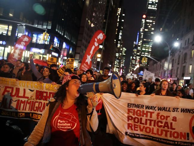 Hundreds of anti-Donald Trump protestors march through the street on 6th Avenue on their way to Trump Tower, November 9, 2016 in New York City. Picture: AFP