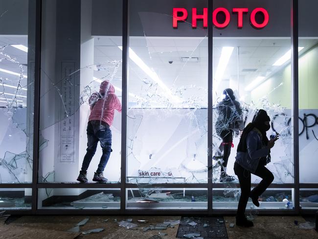 Looters vandalise a Walgreens store during protests against the Minneapolis police shooting of George Floyd in Oakland, California. Picture: AP