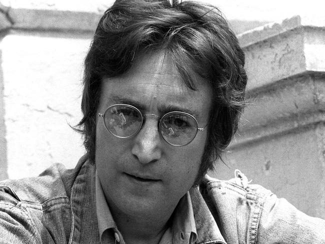 (FILES) In this file photo taken on May 17, 1971 music legend John Lennon poses for photographers in Cannes 17 May 1971 where he presented his movies 'Apotheosis' and 'The Flu'. - John Lennon's career was cut short 40 years ago, on December 8, 1980, when he was shot dead in New York. (Photo by - / AFP)