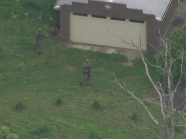 Armed police hunting for the man who allegedly shot at them at a Dumbalk North property. Picture: ABC News