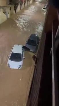 Car Floats Down Street in Valencia After Torrential Rain