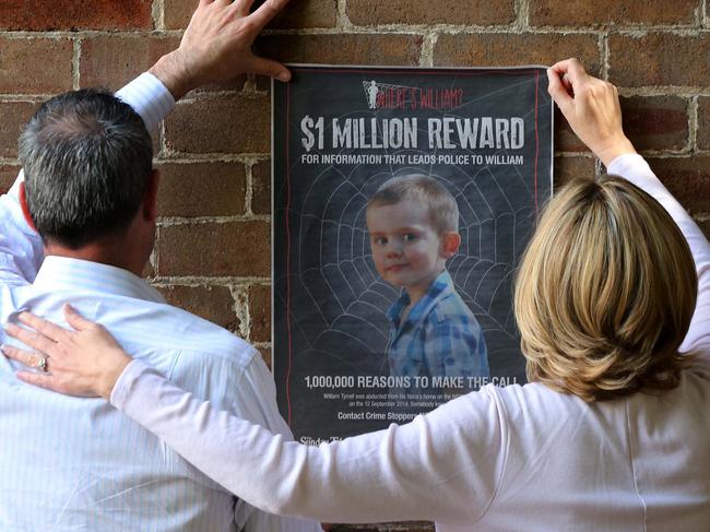 William Tyrrell's parents place the Sunday Telegraph poster of their missing son on a wall in Sydney in 2016. Jubelin ruled out the foster parents (who cannot be named), as suspects in the case.