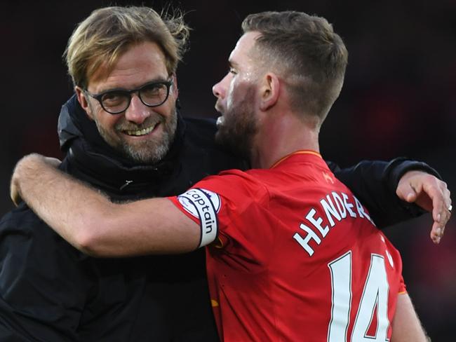 Liverpool's German manager Jurgen Klopp congratulates Jordan Henderson.