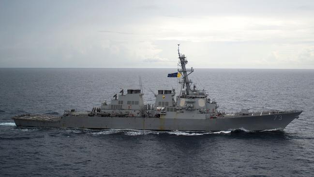 A Chinese warship sailed within metres of a US destroyer, forcing it to change course, in the South China sea. Picture: AFP