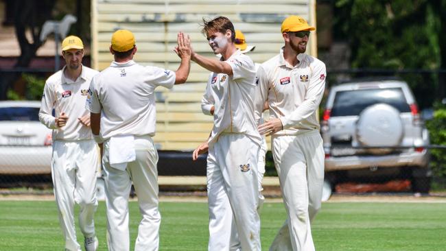 Glenelg bowler Liam Scott, centre, celebrates bowling Sturt batsman Seb Young. Picture: Brenton Edwards