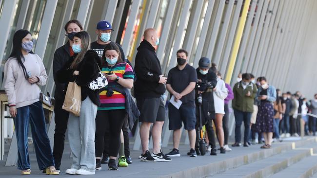 People line up to get their Covid vaccinations at the Melbourne Exhibition Centre. Picture: NCA NewsWire / David Crosling