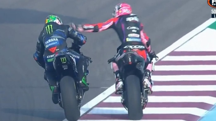Espargaro slaps his rival in a wild blow-up.