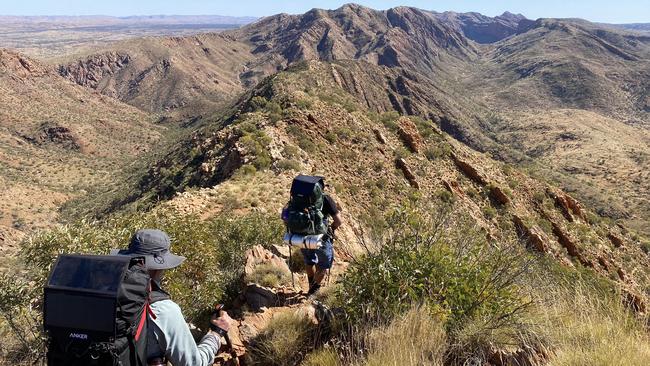 Hikers on Razorback Ridge in the West MacDonnell National Park. Picture: Ryan Cox