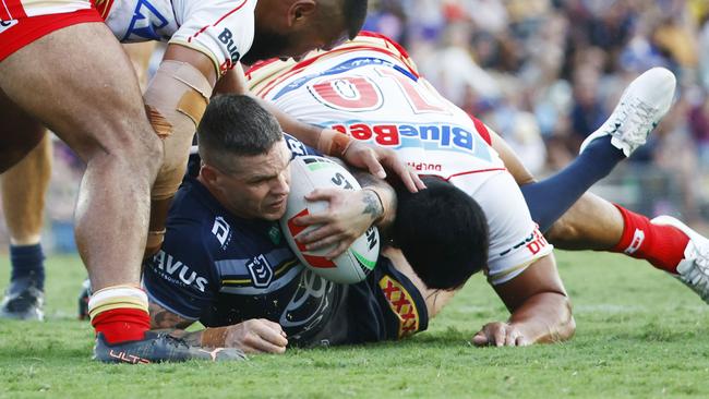 Cowboys' Ben Hampton is stopped in his tracks by the Dolphins' defence in the NRL pre season match between the North Queensland Cowboys and the Redcliffe Dolphins at Barlow Park Picture: Brendan Radke