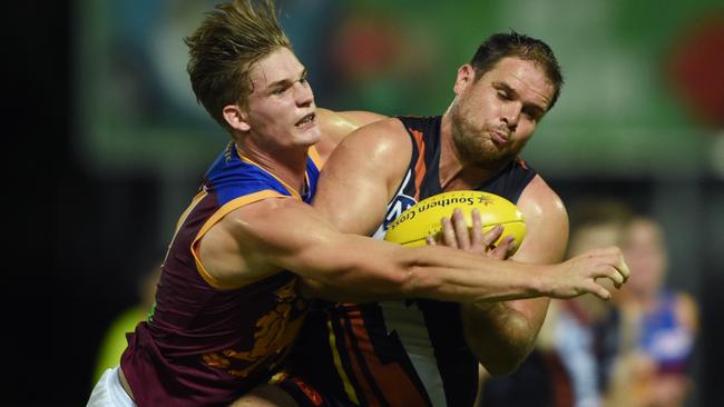 Sam Skinner attempts to spoil Darren Ewing in the NEAFL.