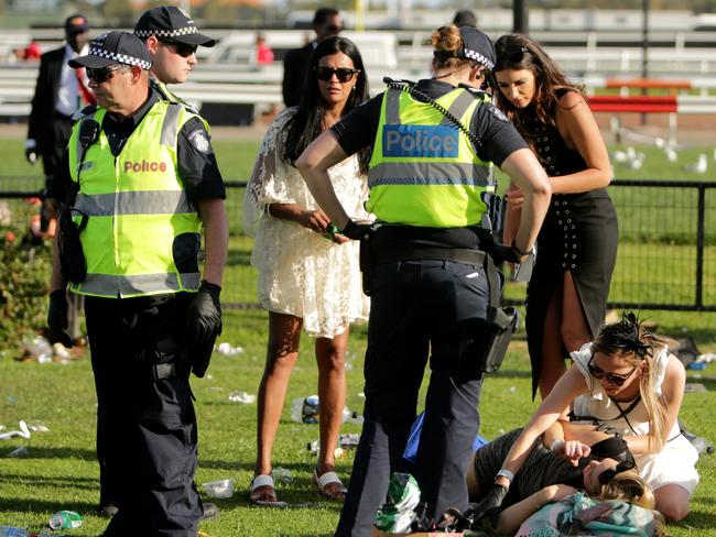 Police try and clear the stragglers on Derby Day.