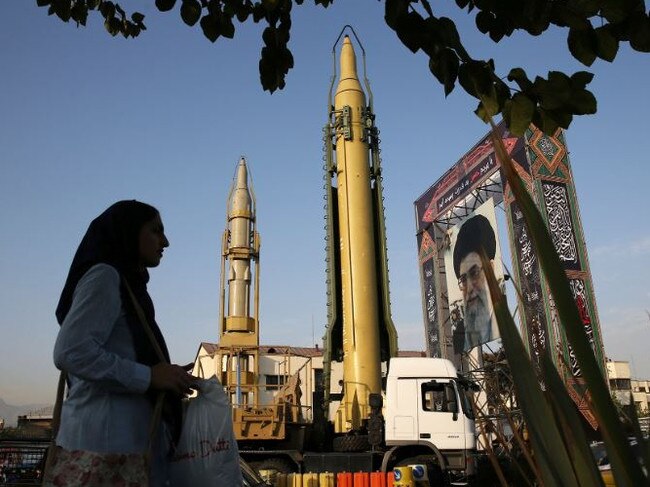 A Ghadr-H missile (centre), a solid-fuel surface-to-surface Sejjil missile, and a portrait of Supreme Leader Ayatollah Ali Khamenei are on display in Tehran. Picture: AP