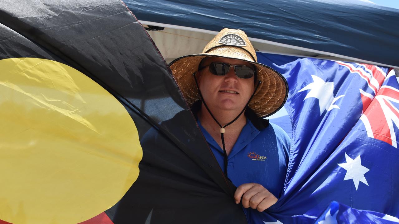 Matt Rix drapes himself in the Aboriginal and Australian flags.