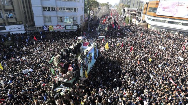 The coffins of Qassem Soleimani and others killed by a US drone strike are carried through mourners in Kerman, Iran. Picture: AP