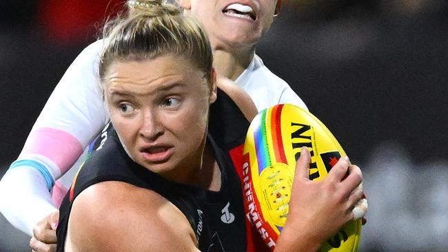 MELBOURNE, AUSTRALIA - OCTOBER 11: Daria Bannister of the Bombers is tackled during the round seven AFLW match between Western Bulldogs and Essendon Bombers at Mission Whitten Oval, on October 11, 2024, in Melbourne, Australia. (Photo by Quinn Rooney/Getty Images)