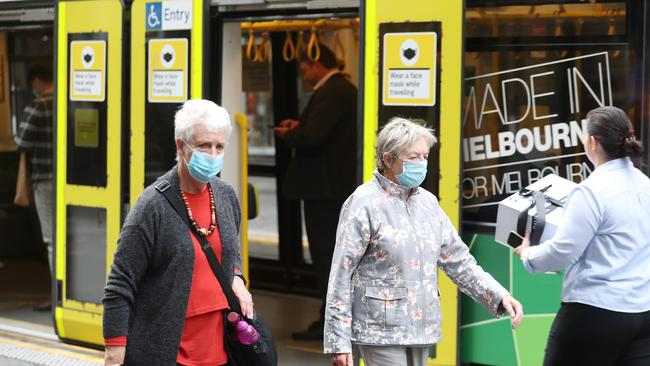 Masks are still mandatory on public transport. Picture: David Crosling