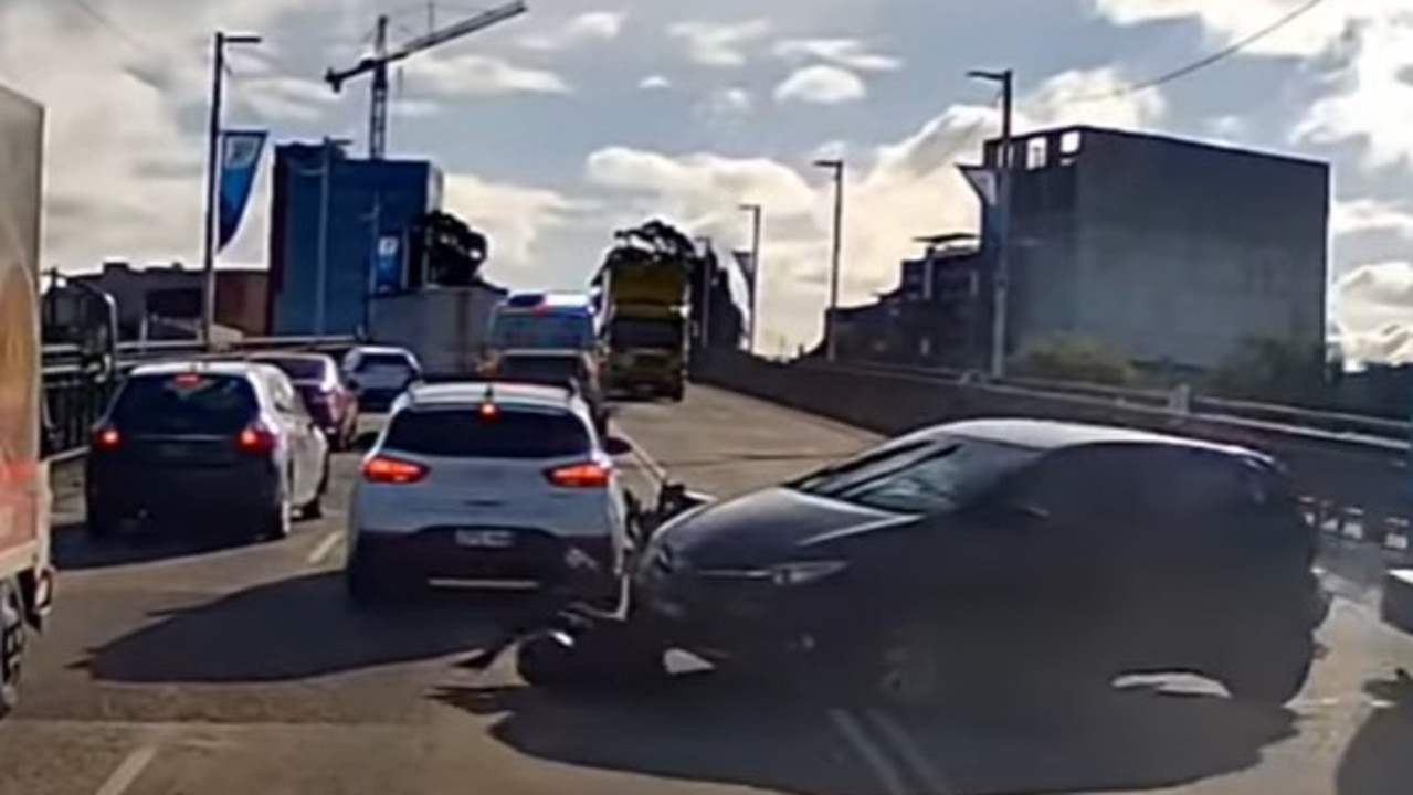 The car runs over the motorbike driver after it was hit by a truck. Picture: Dash Cam Owners of Australia